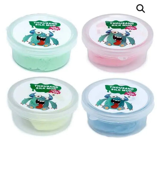 Glow in the Dark Monster Putty in four vibrant colors—green, pink, yellow, and blue—each in a clear container with a playful monster label.