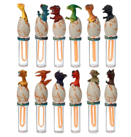 Glow Monster Mud Putty - Glow in Dark Putty with dinosaur figures hatching from cracked eggs atop clear tubes filled with orange glowing putty.