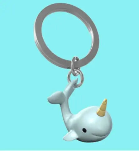 Metal Narval Keyring with smiling narwhal charm and gold horn, perfect for stylish key organization. Durable accessory for everyday use.