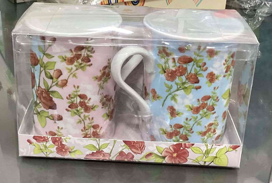 Set of 2 Mugs - Flowers Mug Set in pink and blue floral patterns, packaged in a clear display box. Durable & stylish drinkware for kitchen use.
