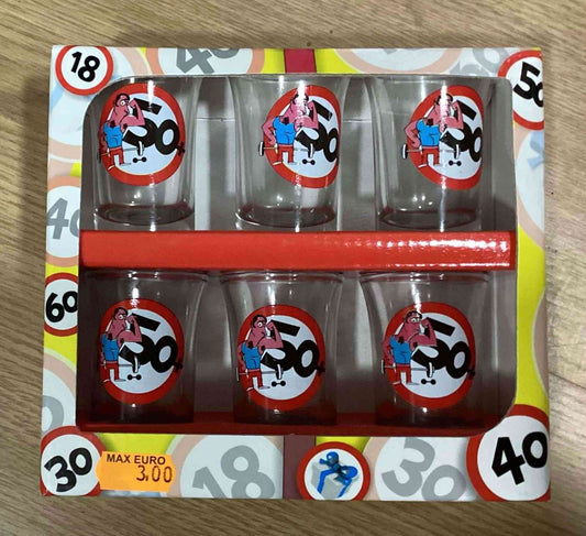 Set of 50th Birthday Shot Glasses featuring cartoon designs in a colorful gift box. Perfect for fun party toasts and milestone celebrations.